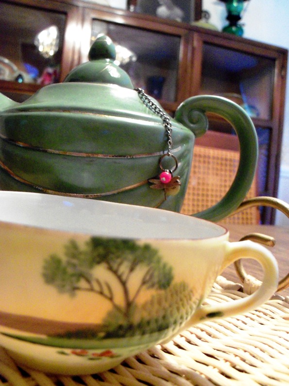 green cup and teapot teaware